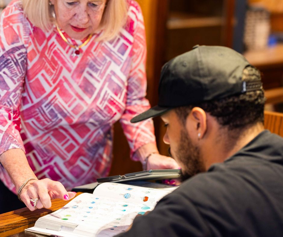 Helping a customer pick jewelry