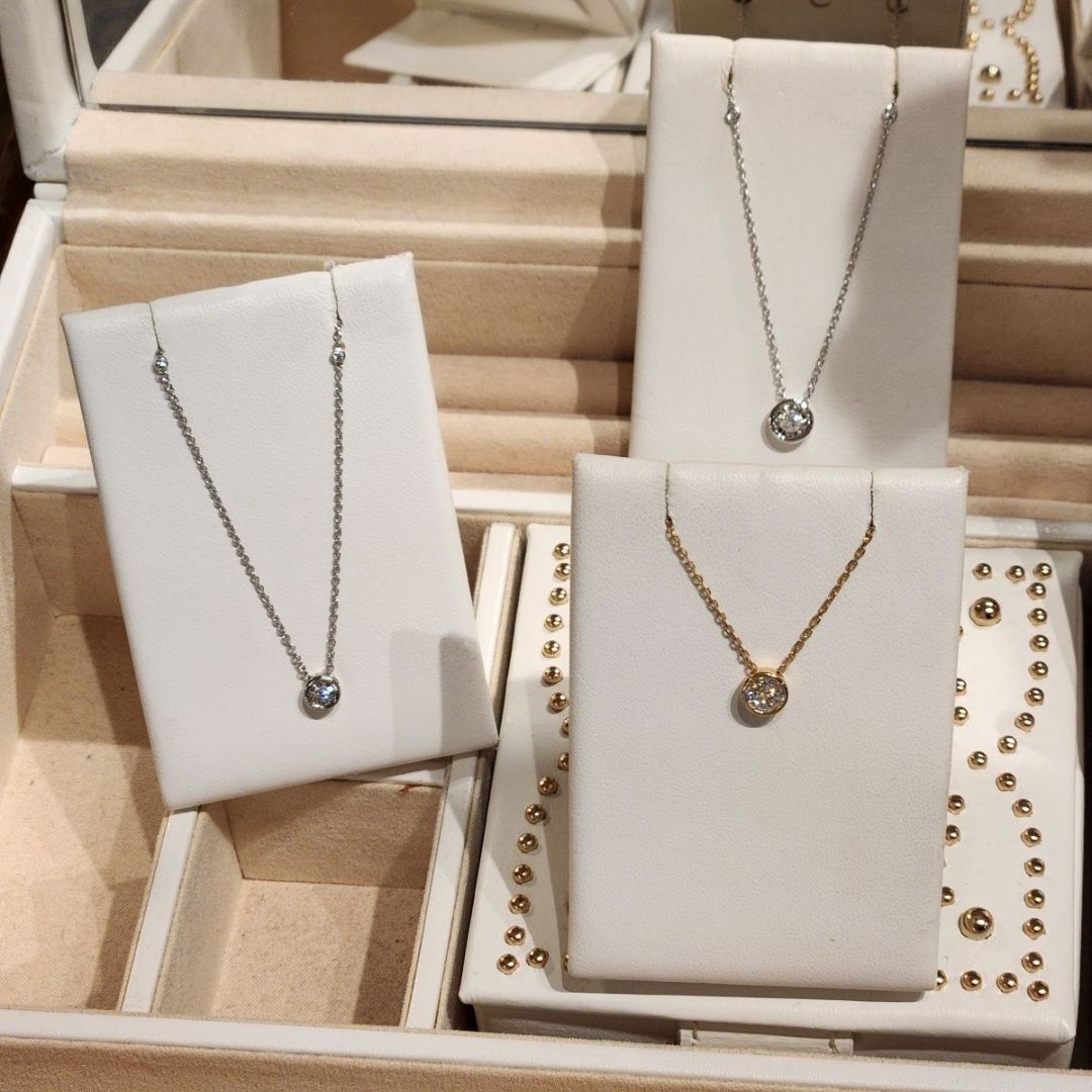 diamond bezel pendant necklaces (three on white backdrops)