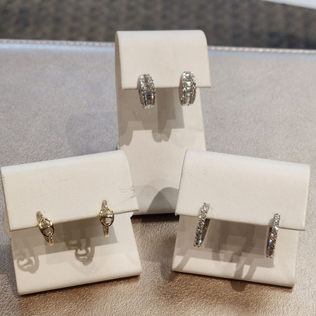 topaz and diamond necklaces displayed with white backdrop